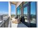 Stunning balcony with seating and panoramic city views under a clear blue sky at 33 S Palm Ave # 1702, Sarasota, FL 34236