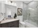 Modern bathroom featuring a glass shower and vanity with large mirror at 33 S Palm Ave # 1702, Sarasota, FL 34236