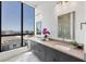 Bright bathroom features a double sink vanity with views from the large window at 33 S Palm Ave # 1702, Sarasota, FL 34236
