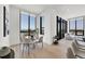 Cozy dining area with floor-to-ceiling windows offering great city views at 33 S Palm Ave # 1702, Sarasota, FL 34236