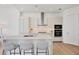 Modern kitchen featuring sleek white cabinetry, quartz countertops, and stainless steel appliances at 33 S Palm Ave # 1702, Sarasota, FL 34236