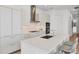 Contemporary kitchen design with an island, stainless steel appliances, and light wood flooring at 33 S Palm Ave # 1702, Sarasota, FL 34236