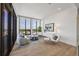 Sunlit living room with expansive windows offering panoramic city views at 33 S Palm Ave # 1702, Sarasota, FL 34236