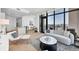 Stylish open-concept living room with balcony access and contemporary decor at 33 S Palm Ave # 1702, Sarasota, FL 34236
