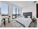 Serene main bedroom featuring floor-to-ceiling windows and a stylish upholstered headboard at 33 S Palm Ave # 1702, Sarasota, FL 34236