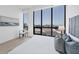 Main bedroom with large windows that provide stunning city and water views at 33 S Palm Ave # 1702, Sarasota, FL 34236