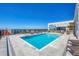 Inviting rooftop pool area featuring a pool, lounge chairs, and clear sky at 33 S Palm Ave # 1702, Sarasota, FL 34236