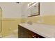 Bathroom with yellow tiling, a vanity with sink, and a mirror at 3599 Bali Dr, Sarasota, FL 34232