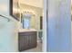 Cozy bathroom featuring a vanity with storage and walk-in shower at 3599 Bali Dr, Sarasota, FL 34232