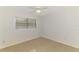Bedroom with a ceiling fan and window providing natural light at 3599 Bali Dr, Sarasota, FL 34232