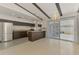 Open concept kitchen with stainless steel appliances, a kitchen island and sleek counters at 3599 Bali Dr, Sarasota, FL 34232