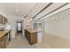 Spacious eat-in kitchen with tile floors, island, and access to the dining room at 3599 Bali Dr, Sarasota, FL 34232