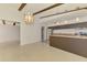 Bright kitchen with stainless steel appliances, kitchen island and open access to the living area at 3599 Bali Dr, Sarasota, FL 34232