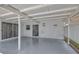 Spacious outdoor patio area with painted concrete floors and security doors for seamless indoor/outdoor living at 3599 Bali Dr, Sarasota, FL 34232
