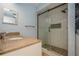 Beautiful bathroom with a modern shower, patterned shower floor and neutral-colored countertop at 3610 54Th W St # B4, Bradenton, FL 34209