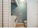 A combined laundry room and half bath offers convenience and efficiency at 3610 54Th W St # B4, Bradenton, FL 34209