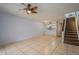 Living room featuring tile flooring, staircase, and eat-in kitchen at 3610 54Th W St # B4, Bradenton, FL 34209