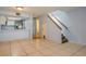 Bright living room featuring tile flooring, staircase, and an eat-in kitchen with stainless steel appliances at 3610 54Th W St # B4, Bradenton, FL 34209