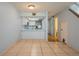 Open concept dining and kitchen area with tiled flooring, bright walls, and modern appliances at 3610 54Th W St # B4, Bradenton, FL 34209