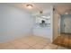 Open dining room and kitchen layout, with tiled floors and blue walls at 3610 54Th W St # B4, Bradenton, FL 34209