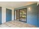 Enclosed patio with tiled flooring, sliding glass door, and additional storage closet at 3610 54Th W St # B4, Bradenton, FL 34209