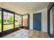 Screened patio with view of landscaping, storage closet, and access to the outdoors at 3610 54Th W St # B4, Bradenton, FL 34209