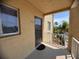 Condo #416 has a shaded balcony with views of lush Florida landscaping at 3647 Lake Bayshore Dr # 416, Bradenton, FL 34205