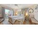 Comfortable main bedroom with a private balcony and neutral decor at 3647 Lake Bayshore Dr # 416, Bradenton, FL 34205