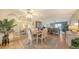 Inviting dining room with a wooden table, mirrored wall, and ample natural light at 3647 Lake Bayshore Dr # 416, Bradenton, FL 34205
