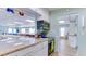 Kitchen with granite countertops, stainless steel oven, and serving hatch to clubhouse at 3647 Lake Bayshore Dr # 416, Bradenton, FL 34205