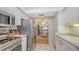 Bright kitchen showcasing stainless steel refrigerator and granite countertops at 3647 Lake Bayshore Dr # 416, Bradenton, FL 34205