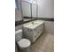 Bathroom featuring a tile floor and vanity with plenty of storage at 3921 Lakeside Rd # 168, Sarasota, FL 34232