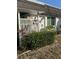 Landscaped home exterior featuring decorative plants and a privacy fence at 3921 Lakeside Rd # 168, Sarasota, FL 34232