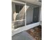 Cozy screened front patio offering bug-free outdoor relaxation at 3921 Lakeside Rd # 168, Sarasota, FL 34232