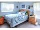 This cozy bedroom features coastal decor, a ceiling fan, and lots of natural light at 3984 Holin Ln, North Port, FL 34287