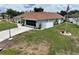 Well-maintained home featuring a screen lanai, white privacy fence, and manicured lawn at 3984 Holin Ln, North Port, FL 34287
