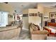 Comfortable living room with neutral tones, plush seating, and open layout at 3984 Holin Ln, North Port, FL 34287