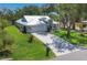 Well-maintained single Gathering home with a manicured front yard and a white metal roof at 425 46Th Nw St, Bradenton, FL 34209
