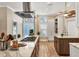 Gourmet kitchen with island cooktop, custom cabinetry, and state of the art stainless appliances at 425 46Th Nw St, Bradenton, FL 34209