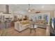 Open living room with vaulted ceilings, ceiling fan, tile floor and plenty of light at 425 46Th Nw St, Bradenton, FL 34209