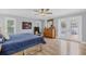 Primary bedroom featuring hardwood floors, a ceiling fan, natural light, and access to patio at 425 46Th Nw St, Bradenton, FL 34209