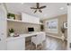 Bright home office with built-in desk, cabinets, and shelves with a window at 425 46Th Nw St, Bradenton, FL 34209