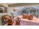 Inviting screened patio with comfortable wicker furniture, perfect for outdoor dining and relaxation at 425 46Th Nw St, Bradenton, FL 34209