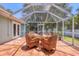 Spacious screened patio with outdoor dining area, ideal for entertaining and enjoying the beautiful weather at 425 46Th Nw St, Bradenton, FL 34209