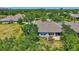 Aerial view of a home showcasing its screened-in lanai and private backyard at 4740 105Th E Ave, Parrish, FL 34219
