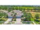 Aerial view of home featuring mature landscaping, a two-car garage, and a well-maintained lawn at 4740 105Th E Ave, Parrish, FL 34219