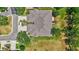 Birds-eye view of home with its well-maintained roof, spacious driveway, and lush landscaping at 4740 105Th E Ave, Parrish, FL 34219