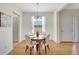Bright dining room with wood table, chandelier, and ample natural light at 4740 105Th E Ave, Parrish, FL 34219