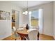 Dining room with hardwood floors, chandelier, and window with views of the backyard at 4740 105Th E Ave, Parrish, FL 34219