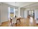 Bright dining room with hardwood floors, chandelier, and views of an adjacent home office at 4740 105Th E Ave, Parrish, FL 34219
